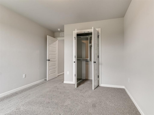 929 SE 16th Ter, Newcastle, OK 73065 - unfurnished bedroom with carpet flooring, baseboards, and a closet