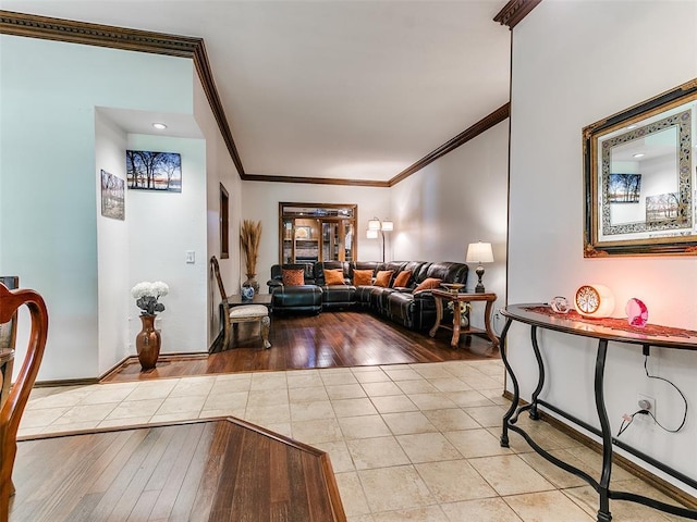 tiled living area with crown molding and baseboards