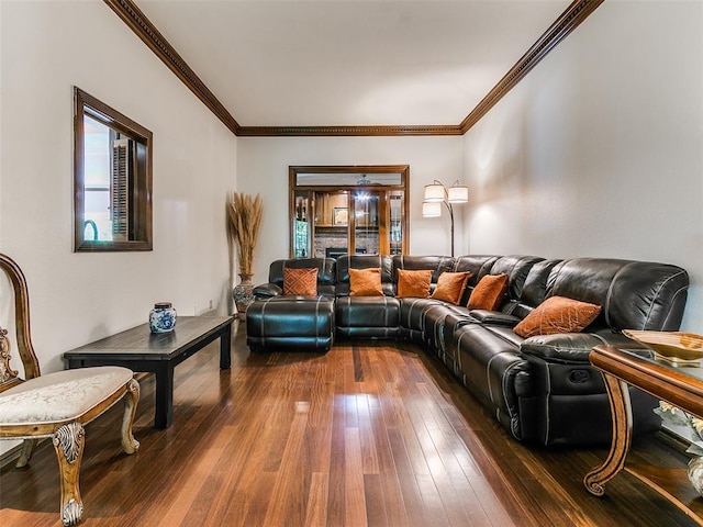 living area featuring dark wood finished floors and ornamental molding