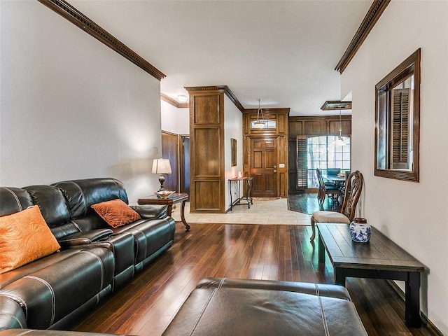 living room featuring ornamental molding and light wood-style floors