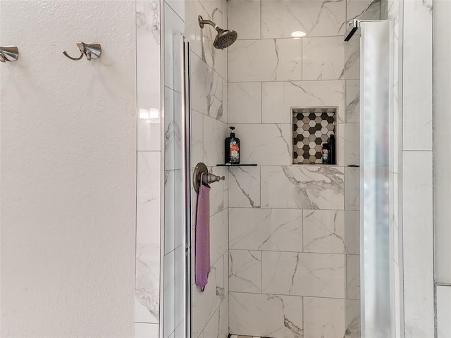 full bath featuring a shower stall
