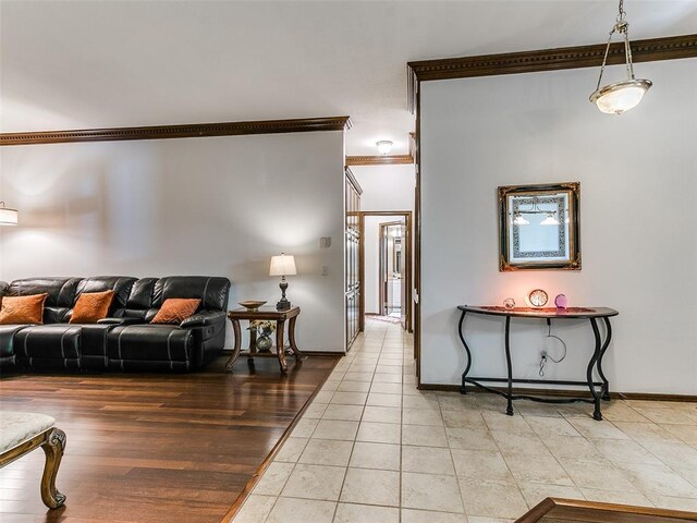 13974 S Broadway St, Edmond, OK 73034 - living room with ornamental molding, light tile patterned flooring, and baseboards