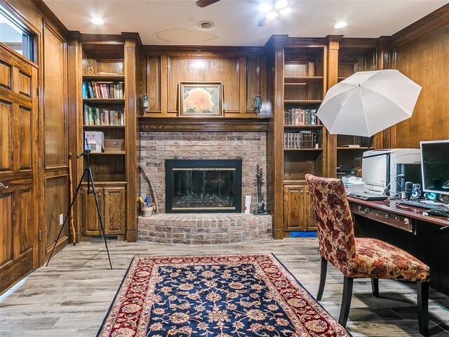 13974 S Broadway St, Edmond, OK 73034 - office space with ceiling fan, wood walls, light wood-style flooring, built in features, and ornamental molding