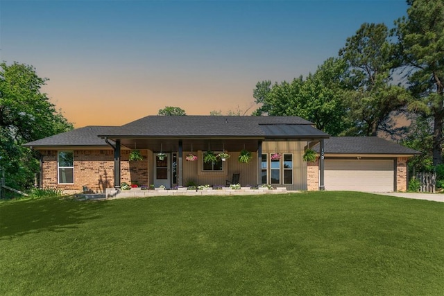 125 Creek Hollow Dr, Choctaw, OK 73020 - ranch-style home featuring a lawn, brick siding, and a garage