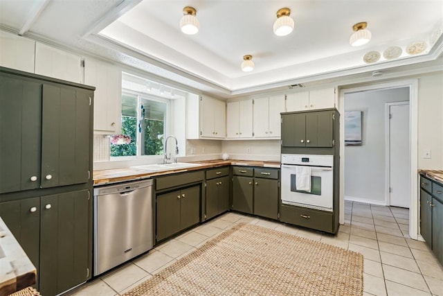 125 Creek Hollow Dr, Choctaw, OK 73020 - kitchen featuring oven, dishwasher, a sink, and light tile patterned floors
