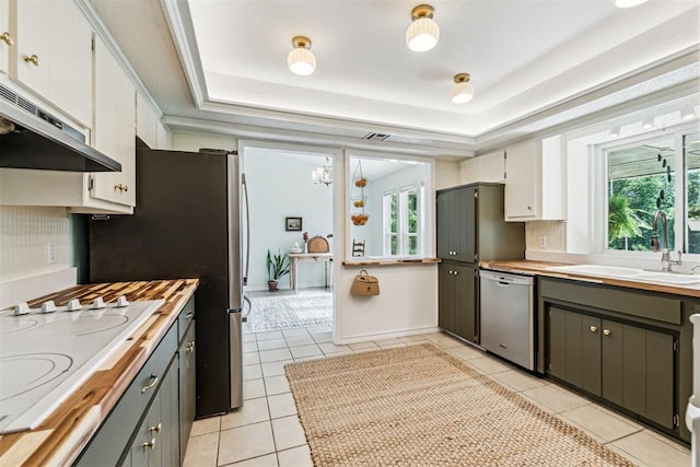 125 Creek Hollow Dr, Choctaw, OK 73020 - kitchen with dishwasher, plenty of natural light, a sink, and white cooktop