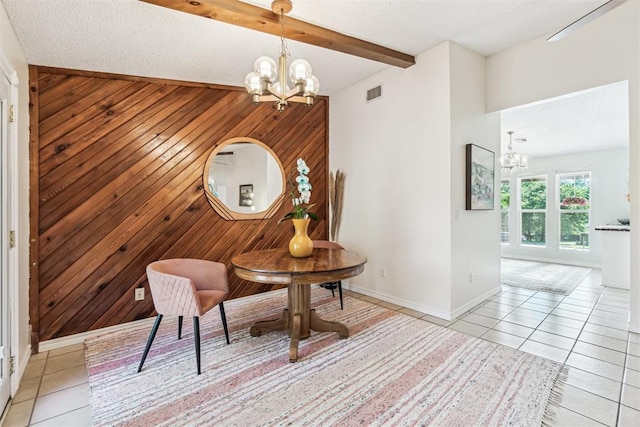 125 Creek Hollow Dr, Choctaw, OK 73020 - living area with a chandelier, light tile patterned flooring, wood walls, and baseboards