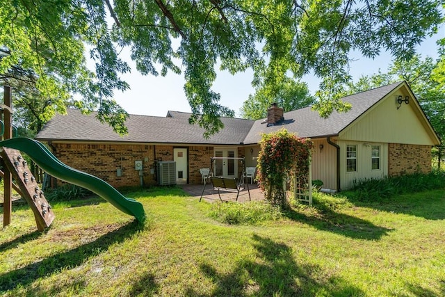 125 Creek Hollow Dr, Choctaw, OK 73020 - back of property featuring a playground, a chimney, a lawn, french doors, and brick siding