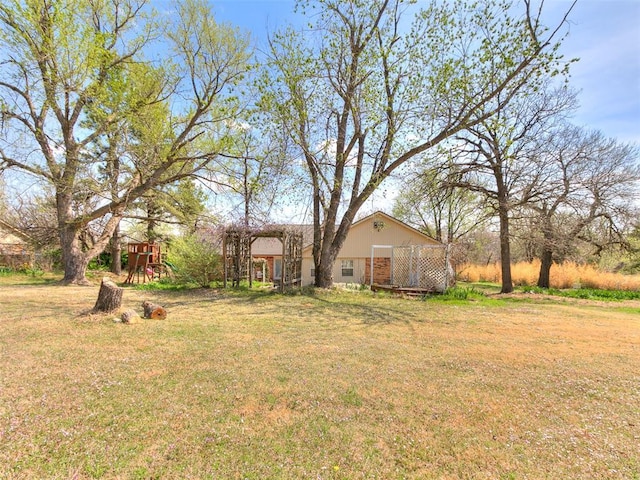 125 Creek Hollow Dr, Choctaw, OK 73020 - view of green lawn featuring a playground