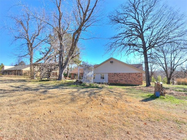 125 Creek Hollow Dr, Choctaw, OK 73020 - view of side of property featuring a yard