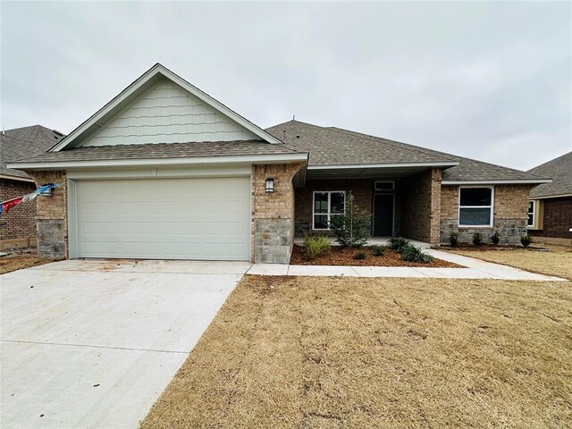 1216 SW 139th St, Oklahoma City, OK 73170 - single story home with a shingled roof, an attached garage, driveway, a front lawn, and brick siding