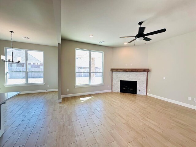 1216 SW 139th St, Oklahoma City, OK 73170 - unfurnished living room featuring healthy amount of natural light, light wood-type flooring, baseboards, and ceiling fan