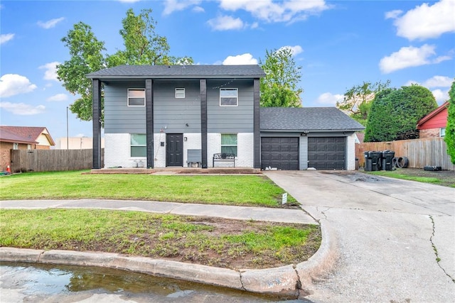 view of front of house with a garage, driveway, and brick siding