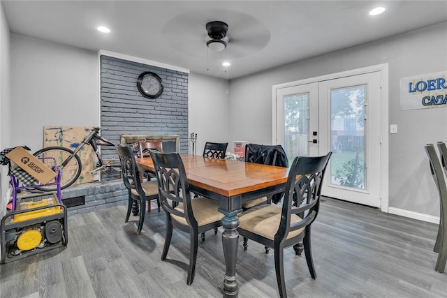 dining room with wood finished floors, a ceiling fan, french doors, recessed lighting, and baseboards