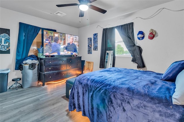 bedroom with wood finished floors and a ceiling fan