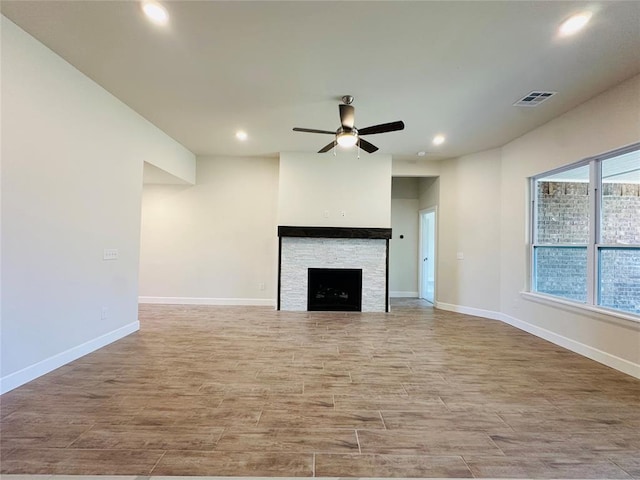 917 SW 141st St, Oklahoma City, OK 73170 - unfurnished living room featuring recessed lighting, ceiling fan, light wood-style floors, baseboards, and a fireplace