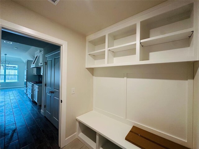 917 SW 141st St, Oklahoma City, OK 73170 - mudroom featuring baseboards