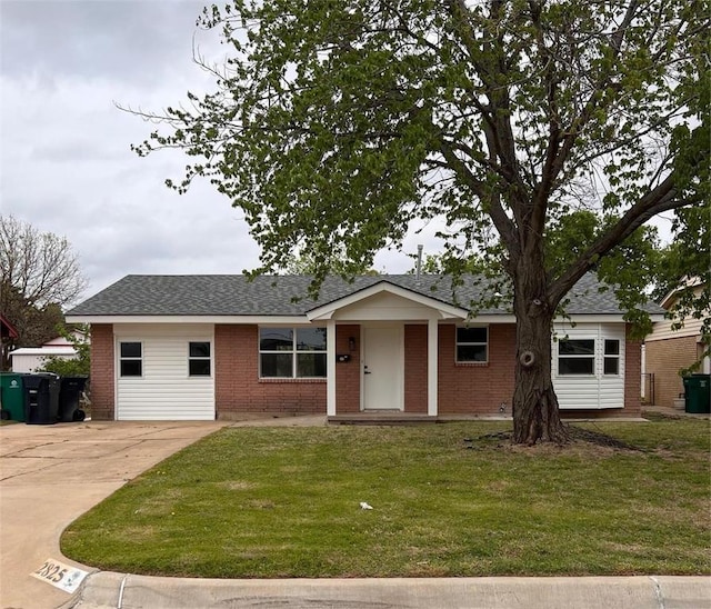 2825 SW 88th St, Oklahoma City, OK 73159 - ranch-style home with brick siding, a front lawn, concrete driveway, and a shingled roof