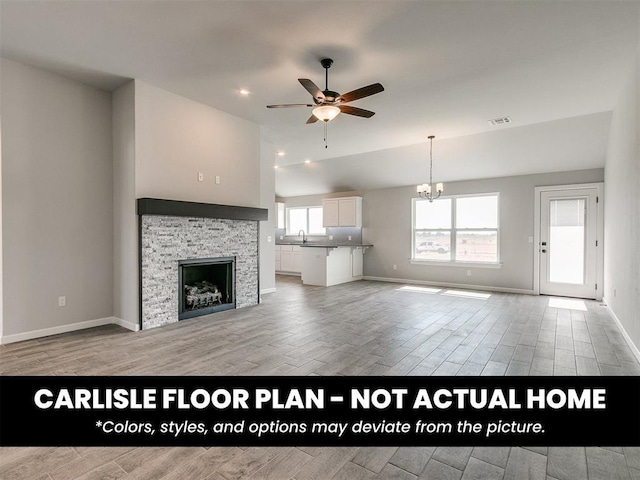 8517 NW 76th St, Oklahoma City, OK 73132 - unfurnished living room featuring a ceiling fan, light wood finished floors, baseboards, and a fireplace