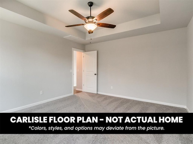8517 NW 76th St, Oklahoma City, OK 73132 - spare room with ceiling fan, baseboards, carpet flooring, and a raised ceiling