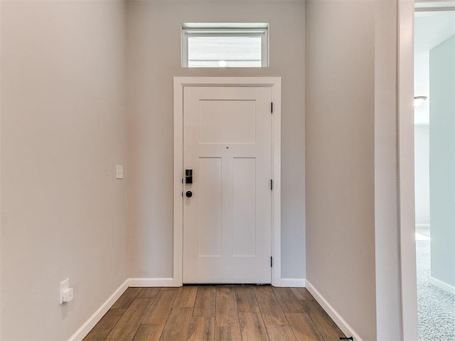 8617 NW 77th St, Oklahoma City, OK 73132 - entryway featuring baseboards and wood finished floors