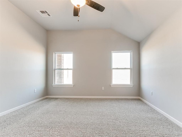 8617 NW 77th St, Oklahoma City, OK 73132 - unfurnished room with ceiling fan, carpet, healthy amount of natural light, vaulted ceiling, and baseboards