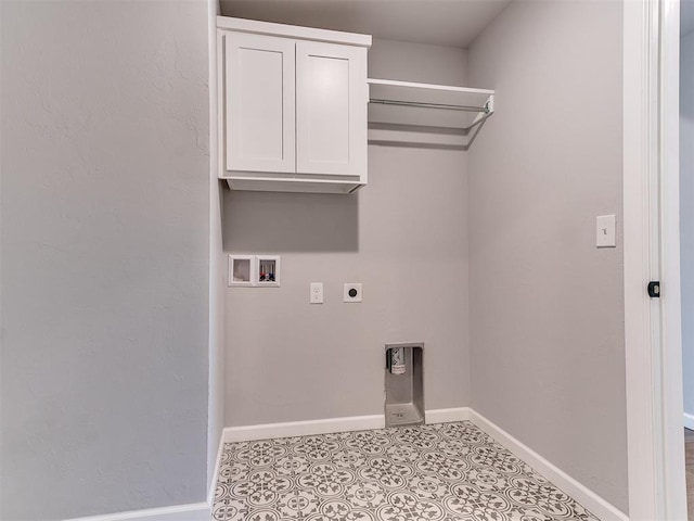8617 NW 77th St, Oklahoma City, OK 73132 - washroom featuring electric dryer hookup, hookup for a washing machine, cabinet space, baseboards, and tile patterned flooring