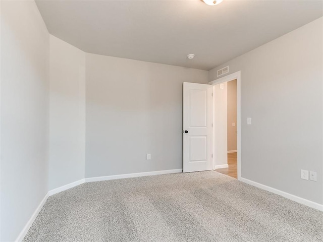 8617 NW 77th St, Oklahoma City, OK 73132 - unfurnished room with carpet flooring and baseboards