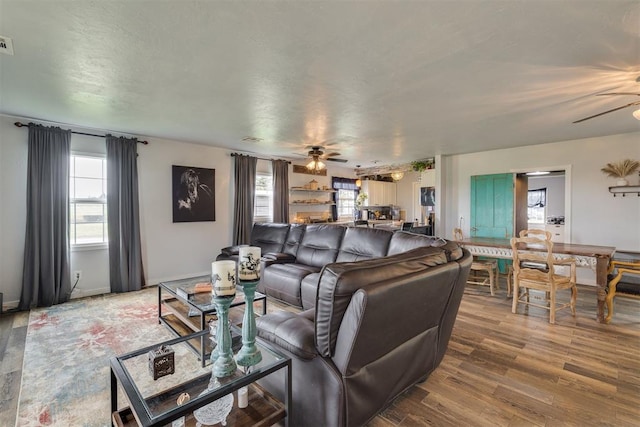 2316 E 68th St, Stillwater, OK 74074 - living room featuring ceiling fan and wood finished floors