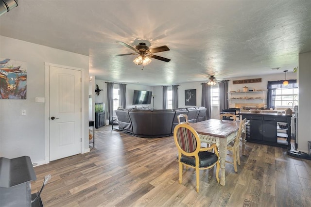 2316 E 68th St, Stillwater, OK 74074 - dining room with ceiling fan, wood finished floors, and baseboards