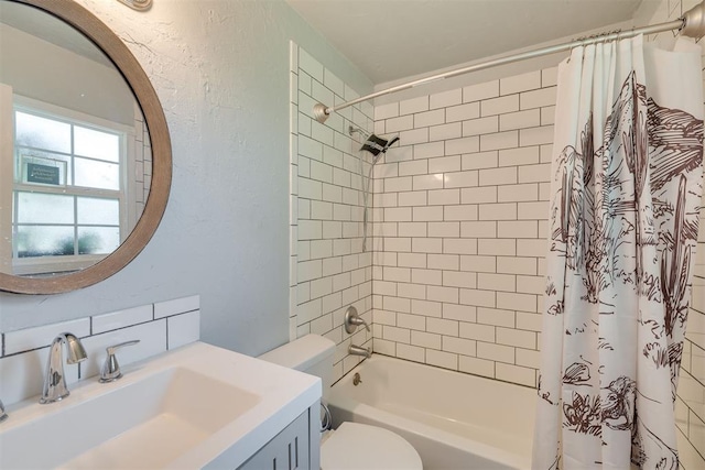 2316 E 68th St, Stillwater, OK 74074 - bathroom with toilet, a textured wall, shower / bathtub combination with curtain, and vanity