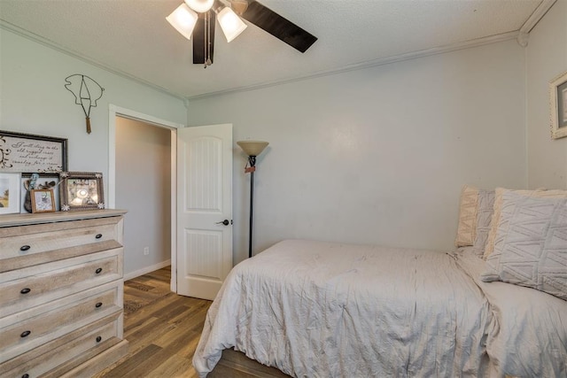 2316 E 68th St, Stillwater, OK 74074 - bedroom featuring wood finished floors, crown molding, and ceiling fan