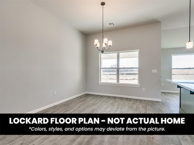 8609 NW 76th St, Oklahoma City, OK 73132 - unfurnished dining area featuring a chandelier, plenty of natural light, wood finished floors, and baseboards
