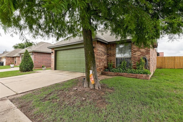 1312 SW 25th St, Moore, OK 73170 - view of front facade with concrete driveway, brick siding, and an attached garage