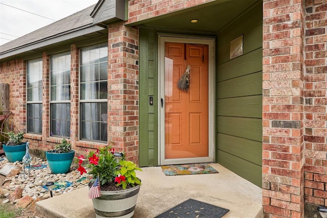 1312 SW 25th St, Moore, OK 73170 - view of exterior entry featuring brick siding