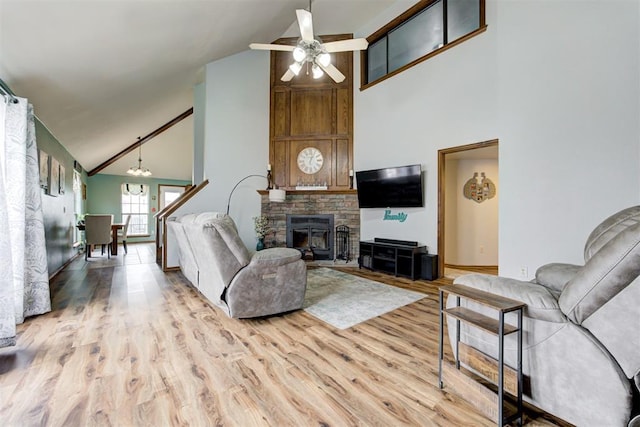 1312 SW 25th St, Moore, OK 73170 - living room featuring high vaulted ceiling, a ceiling fan, wood finished floors, and baseboards