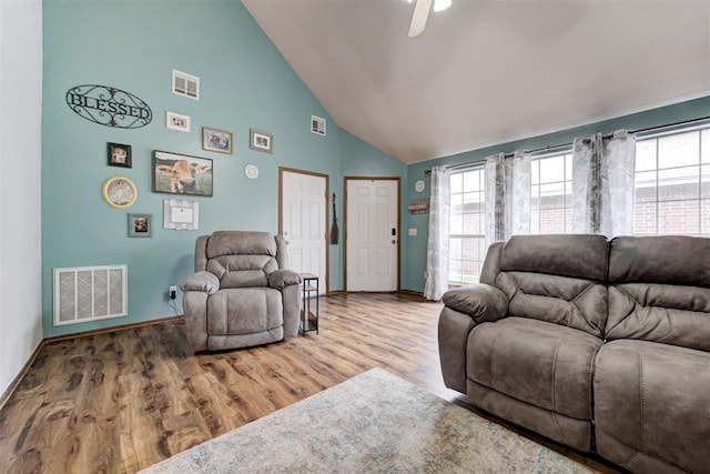 1312 SW 25th St, Moore, OK 73170 - living room featuring high vaulted ceiling, baseboards, wood finished floors, and ceiling fan