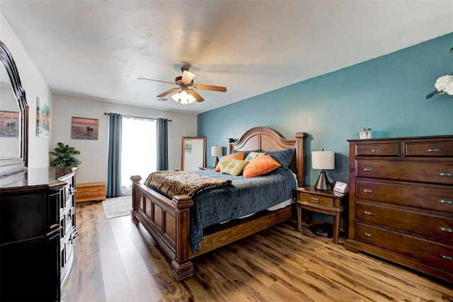 1312 SW 25th St, Moore, OK 73170 - bedroom with light wood finished floors and a ceiling fan