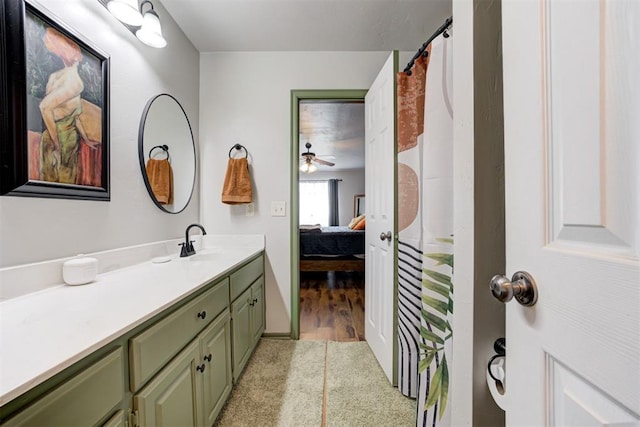 1312 SW 25th St, Moore, OK 73170 - ensuite bathroom featuring vanity, a shower with shower curtain, and ceiling fan