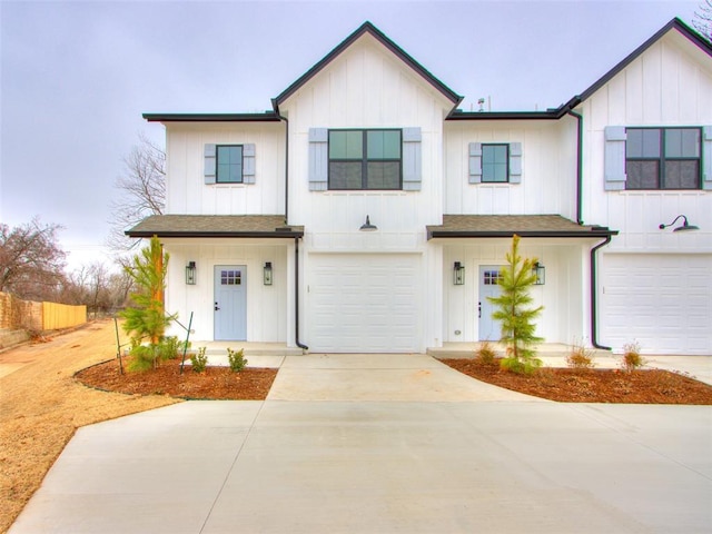 2812 Shoreridge Ave Unit 2812, Norman, OK 73072 - view of front of house with an attached garage, concrete driveway, board and batten siding, and fence