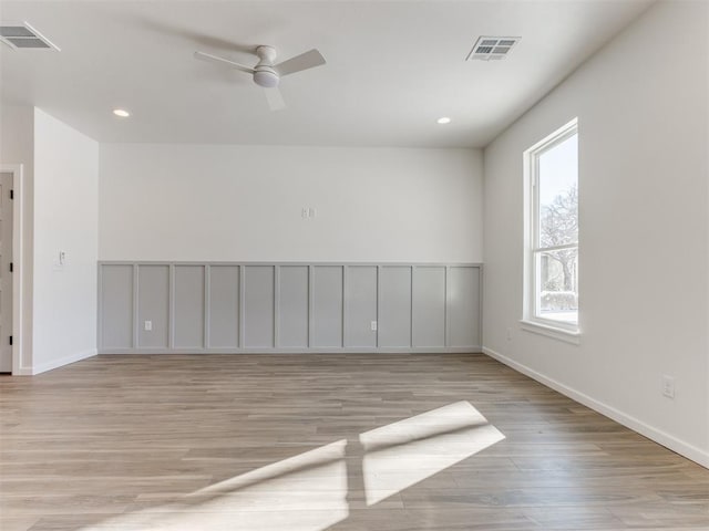 2812 Shoreridge Ave Unit 2812, Norman, OK 73072 - unfurnished room featuring plenty of natural light, baseboards, light wood-style floors, ceiling fan, and recessed lighting