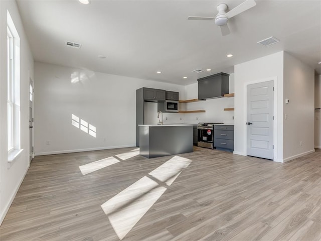 2812 Shoreridge Ave Unit 2812, Norman, OK 73072 - unfurnished living room with ceiling fan, light wood-type flooring, baseboards, recessed lighting, and a sink