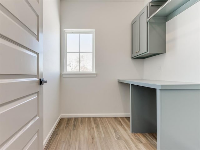 2812 Shoreridge Ave Unit 2812, Norman, OK 73072 - washroom with baseboards and light wood-style floors