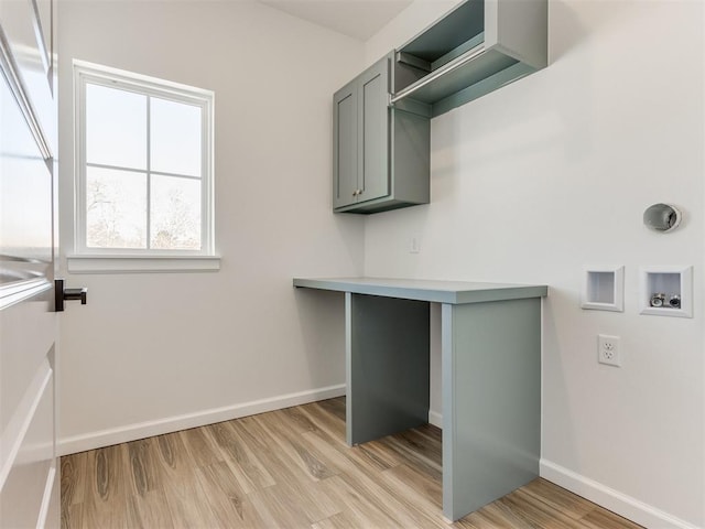 2812 Shoreridge Ave Unit 2812, Norman, OK 73072 - washroom featuring cabinet space, light wood-style flooring, baseboards, and washer hookup