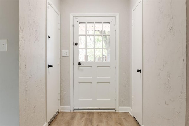 2424 Ashley Dr, The Village, OK 73120 - doorway to outside with light wood-style flooring and baseboards