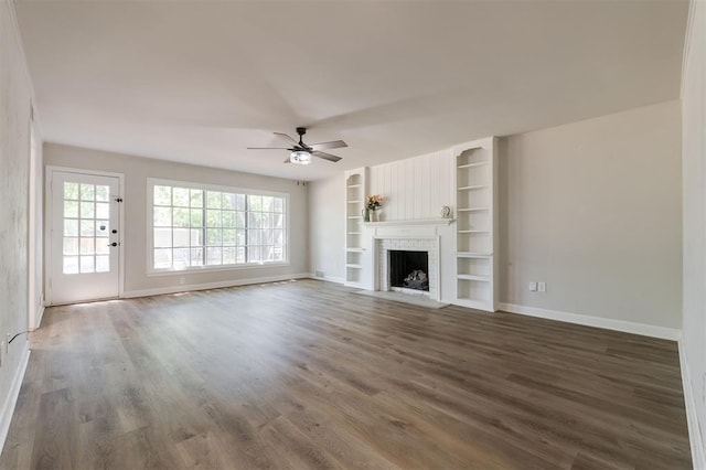 2424 Ashley Dr, The Village, OK 73120 - unfurnished living room featuring baseboards, a ceiling fan, wood finished floors, and a fireplace with flush hearth