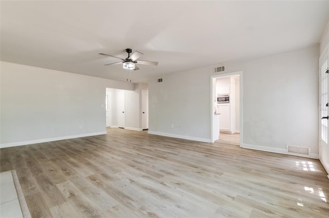 2424 Ashley Dr, The Village, OK 73120 - empty room with ceiling fan, baseboards, and light wood-style floors