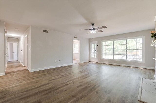 2424 Ashley Dr, The Village, OK 73120 - unfurnished room with baseboards, ceiling fan, and wood finished floors