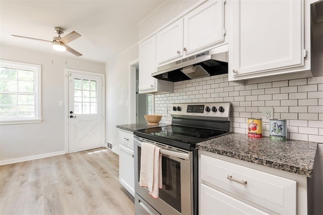 2424 Ashley Dr, The Village, OK 73120 - kitchen featuring under cabinet range hood, stainless steel electric stove, white cabinetry, a ceiling fan, and decorative backsplash