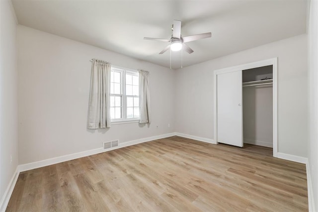 2424 Ashley Dr, The Village, OK 73120 - unfurnished bedroom featuring light wood-style floors, baseboards, a closet, and a ceiling fan
